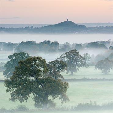 "Avalonian Rainforest" large greeting card featuring Glastonbury Tor on a misty morning.