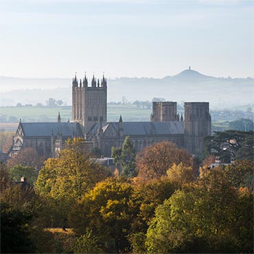 "Autumnal Poem" large greeting card featuring Wells Cathedral surrounded by autumnal trees.